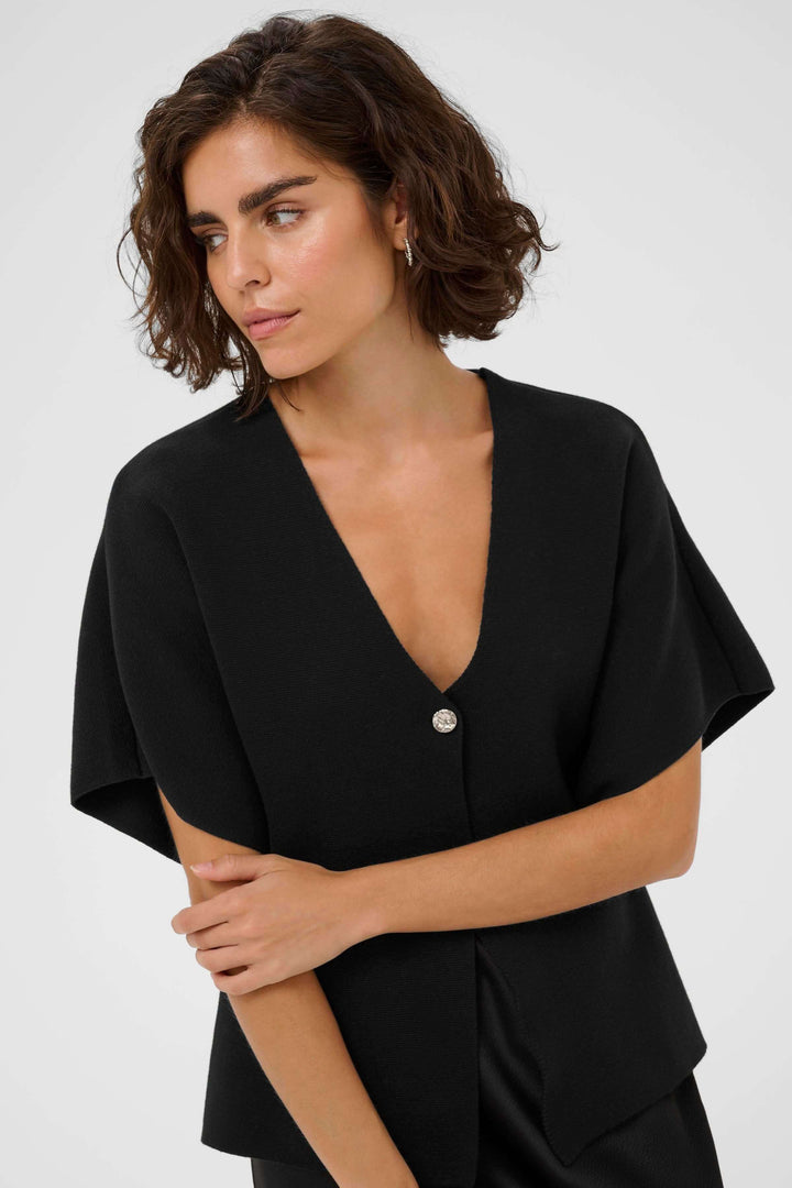 Cardigan Jessica moderne avec encolure en V, design épuré, coupe évasée et matériau confortable.