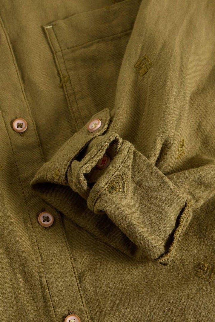 Chemise en coton manches retroussables avec détails de boutons et poche poitrine, tissu kaki.