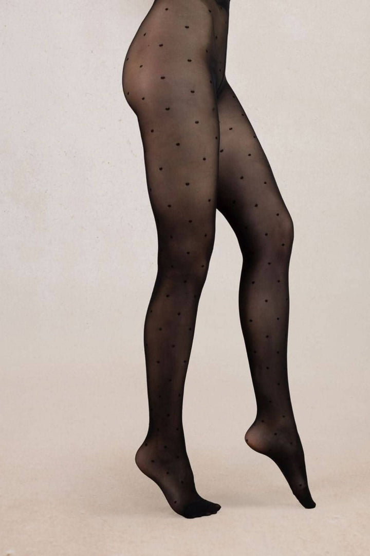 Collant semi-opaque noir à pois, parfait pour ajouter une touche originale à votre tenue.
