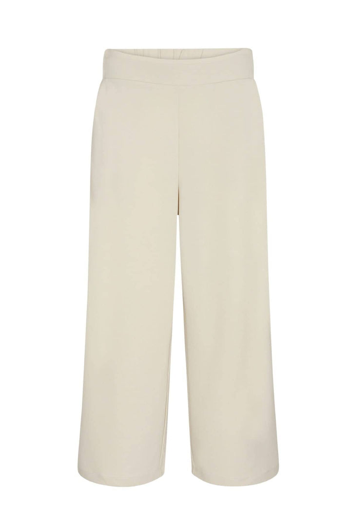 Pantalon jambe large en mélangé de polyester recyclé, couleur crème, coupe décontractée avec taille élastique.