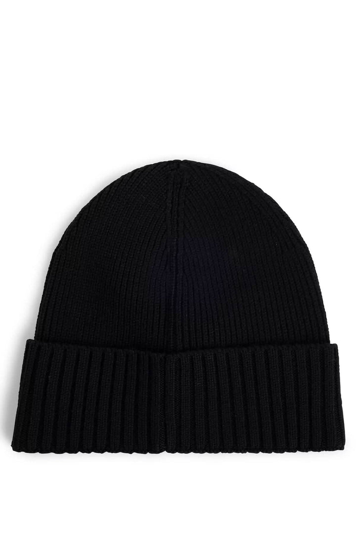 Bonnet en laine noir, tricoté avec structure côtelée et revers, accessoire douillet.