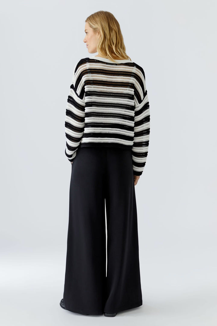 Side view of a multicolored, openwork striped women&