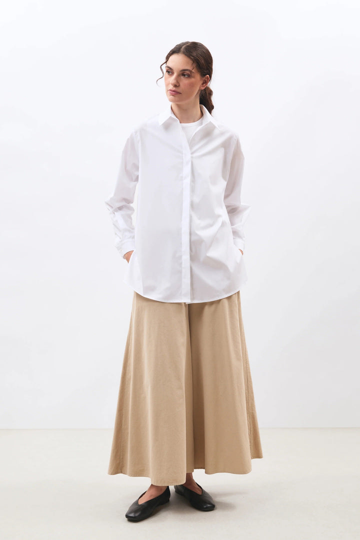 Junglio women’s long shirt, front view Humility