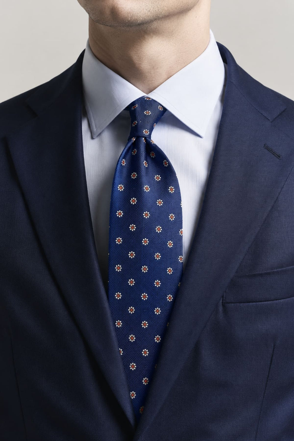 Side view of a blue Eton geometric-patterned tie with contrasting details for men - Valérie Simon