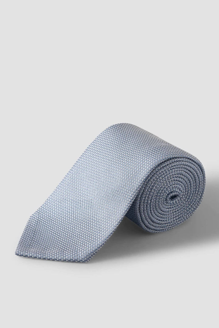 Front view of a blue Eton-style textured silk grenadine tie for men - Valérie Simon