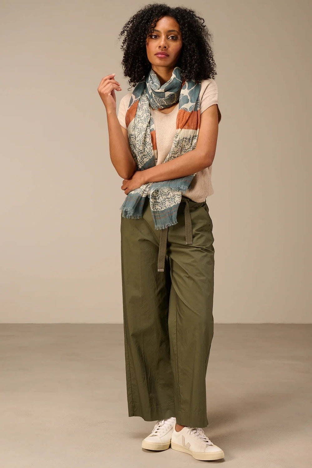 Side view of a lightweight Nile-print scarf in pastel shades worn by a woman - Valérie Simon