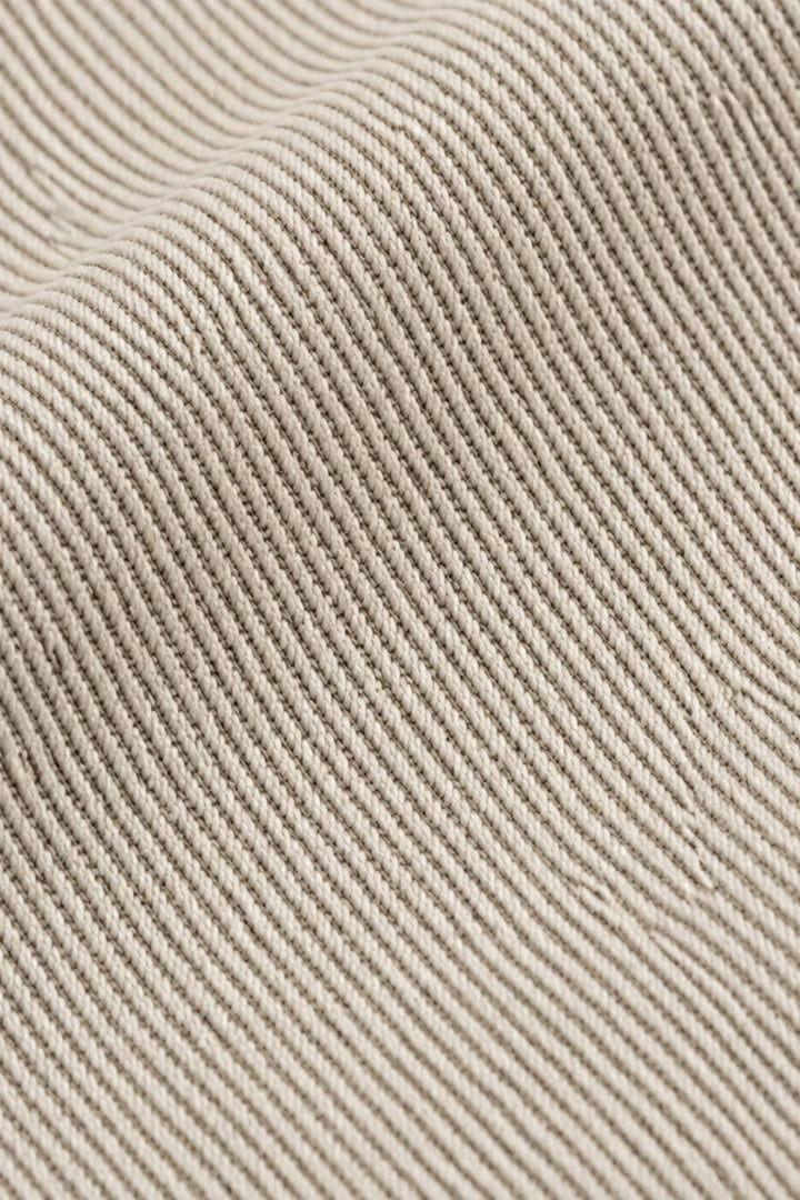 Side view of textured beige Meyer chino pants for men with brown belt - Valérie Simon