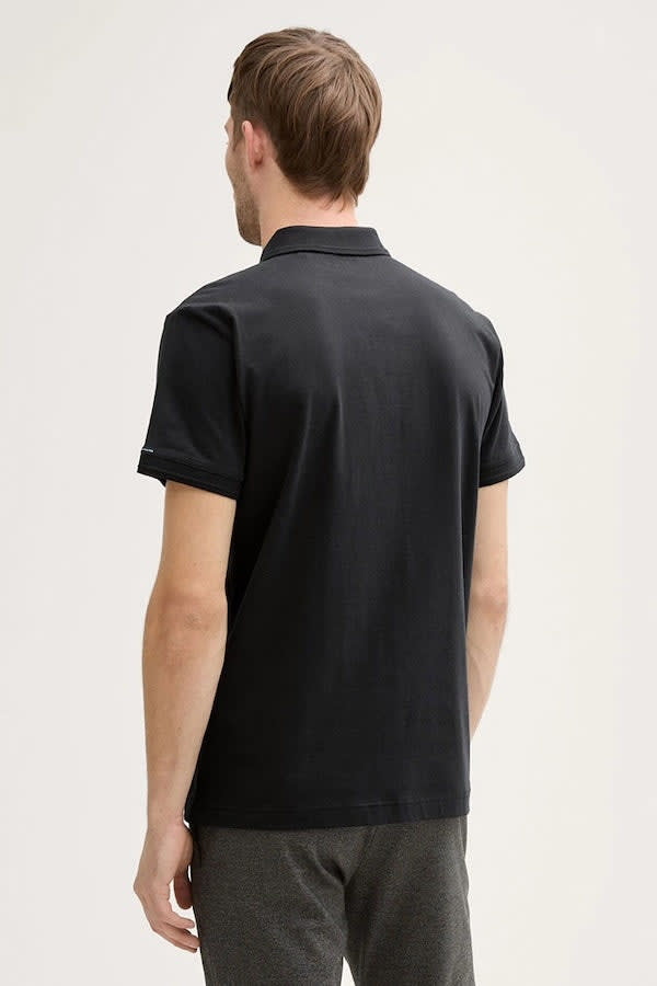 Front view of the blue Tom Tailor men's polo shirt with chest logo - Valérie Simon