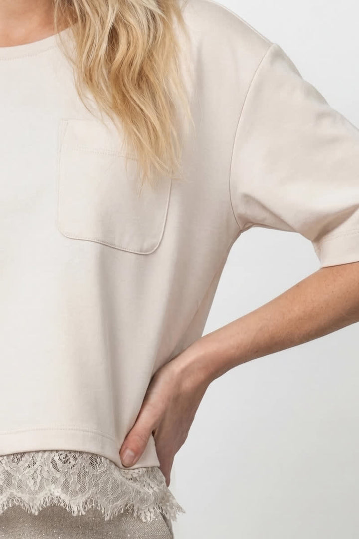 Front view of the loose-fit T-shirt with lace detail for women by Monari