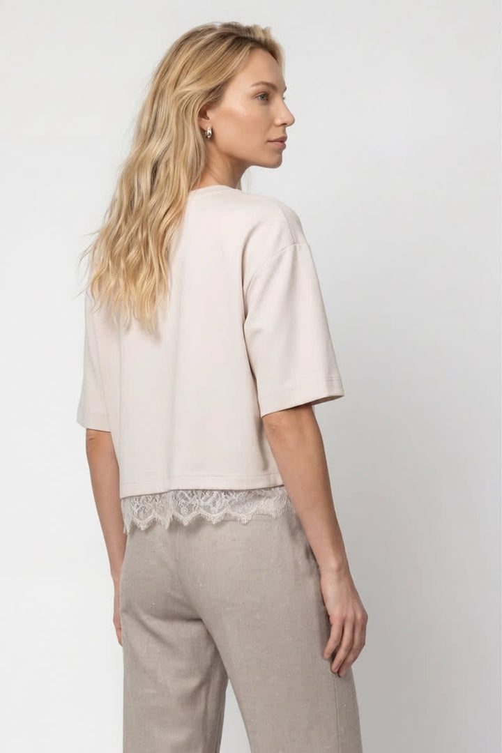 Front view of the loose-fit T-shirt with lace detail for women by Monari