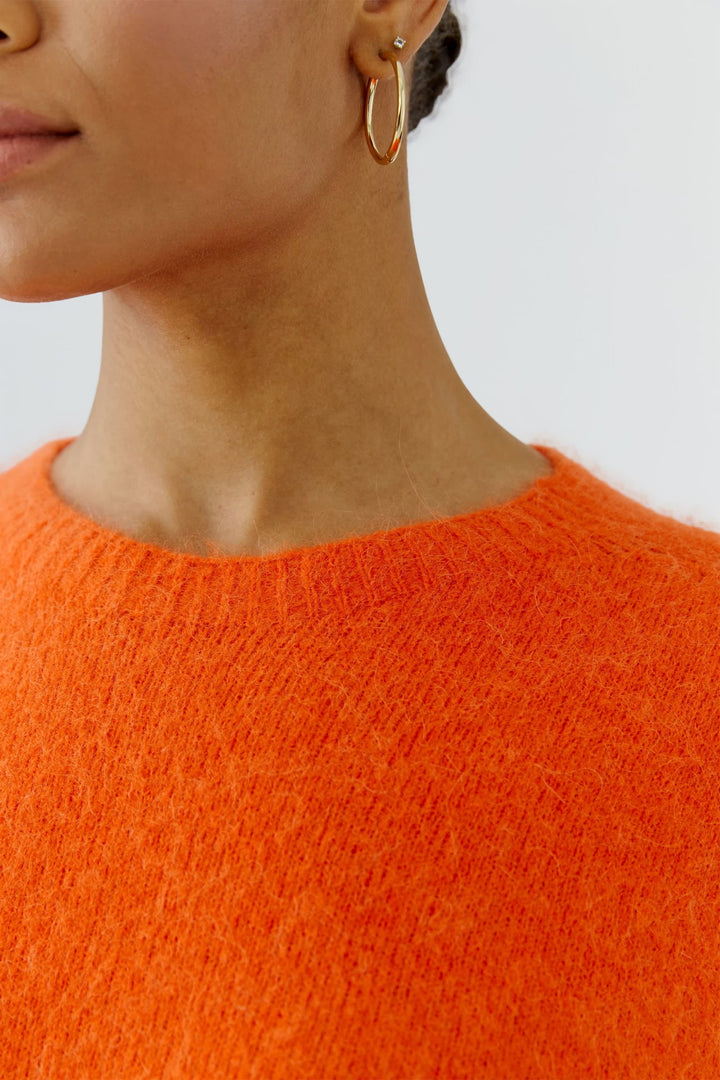 Front view of the women’s beige fluffy knit sweater with ribbed details - Valérie Simon