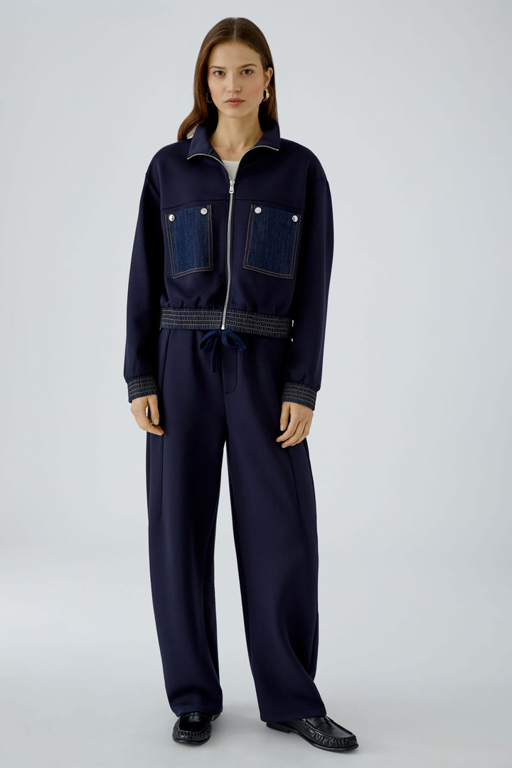 Women’s short zip-up jacket with denim detailing, front view Oui