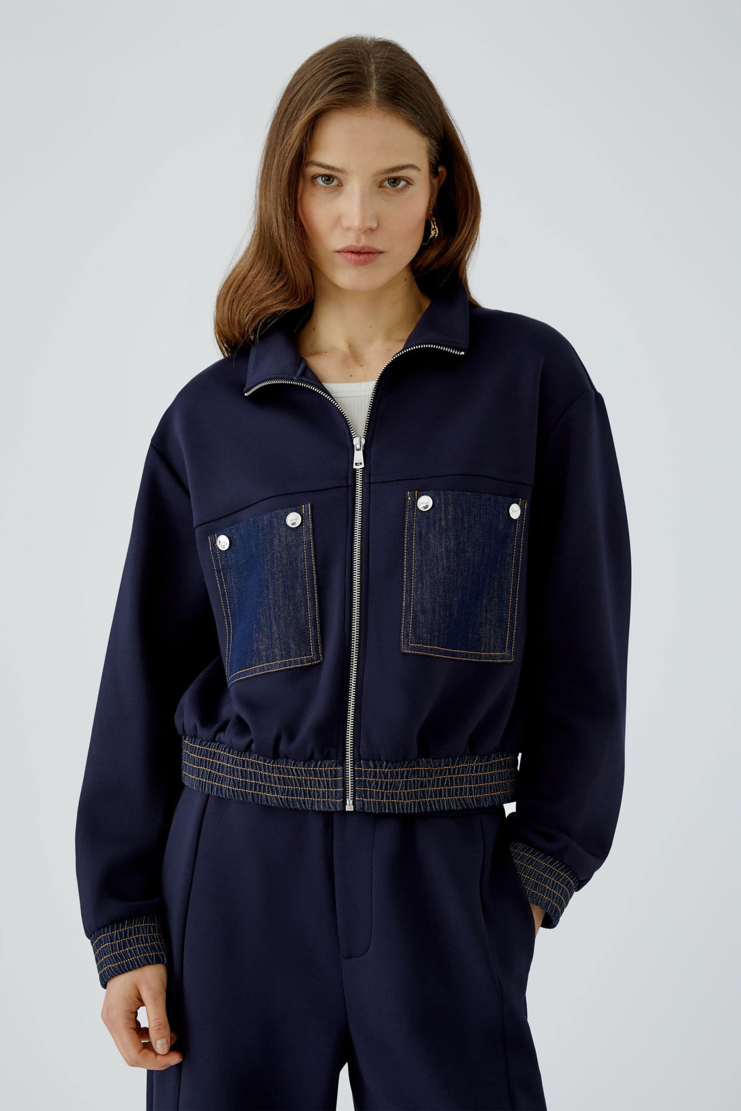 Women’s short zip-up jacket with denim detailing, front view Oui