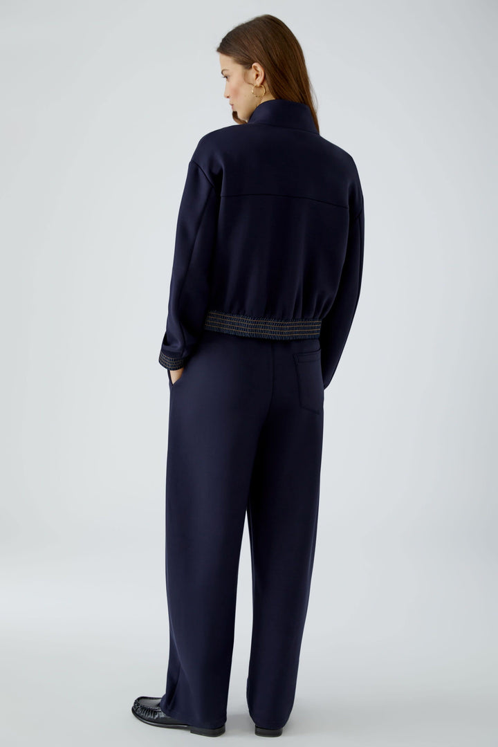 Women’s blue short zip-up jacket with denim detailing, front view Oui
