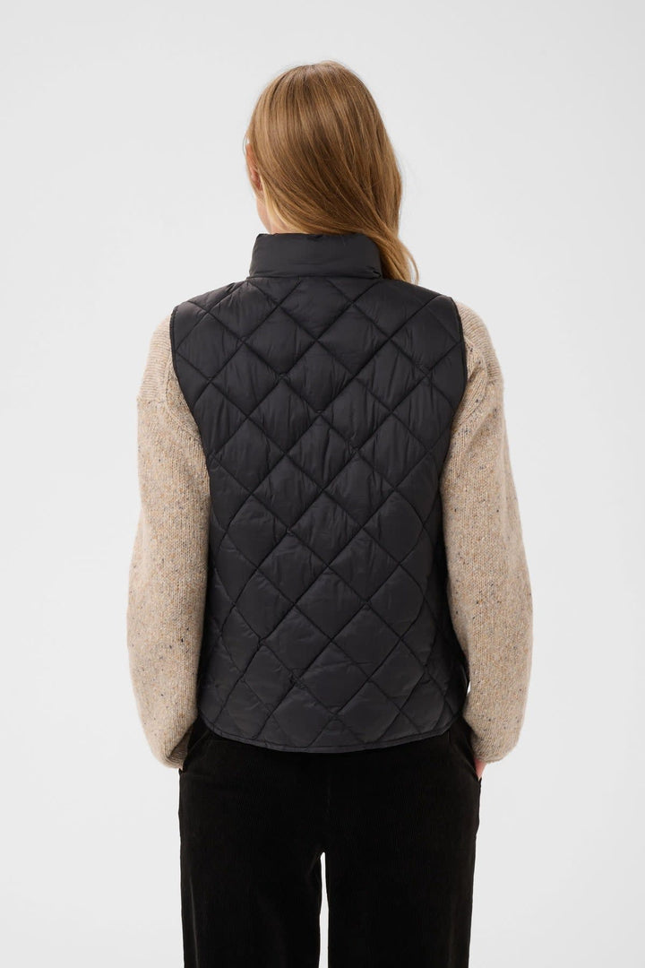 Side view of the Carlota quilted jacket for women in beige with buttons and pockets Part Two - Valérie Simon