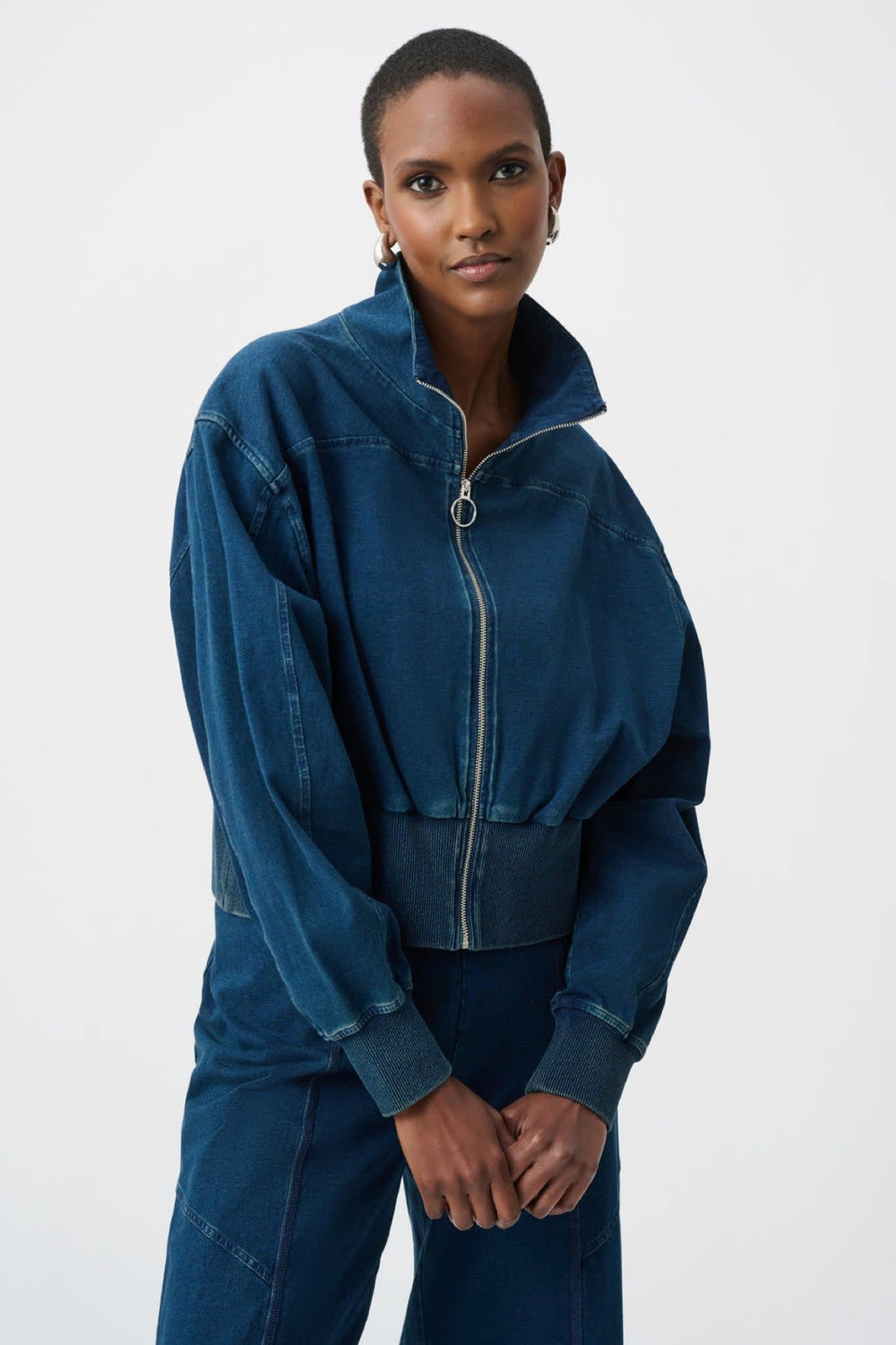 Front view of a black Joseph Ribkoff women's zip-up jacket with a high collar - Valérie Simon