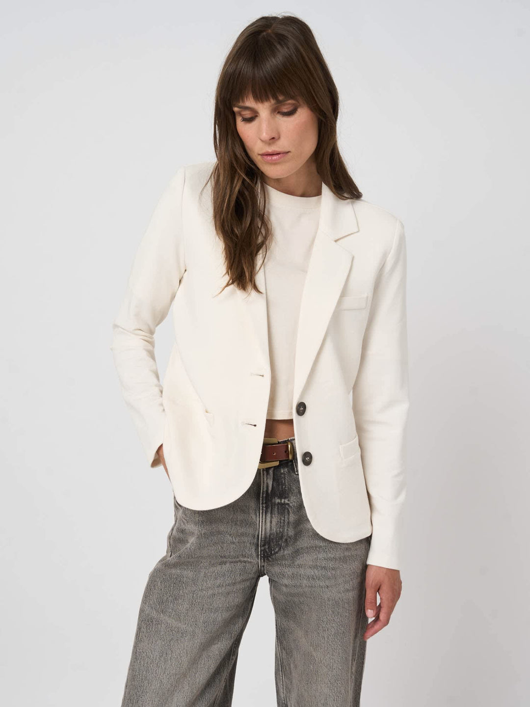 Front view of women’s two-button blazer Repeat Cashmere in grey, worn with button detail - Valérie Simon