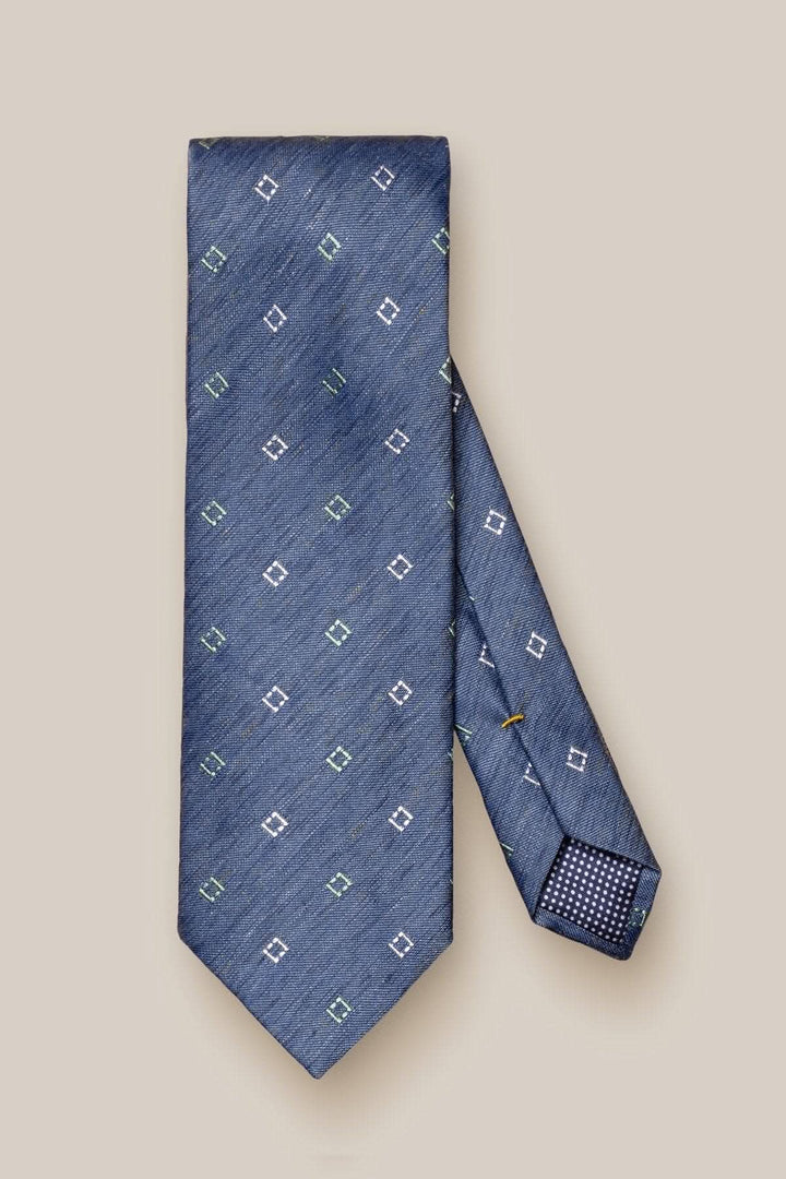 Cravate à motifs en soie et lin, bleu avec motifs géométriques, idéale pour affaires et événements romantiques.