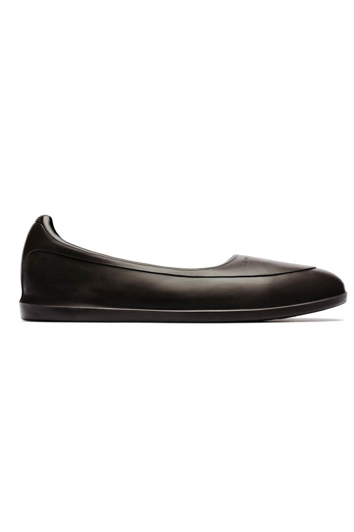 Galoche brune élégante, conçue pour protéger vos chaussures de la pluie et de la neige tout en offrant un style intemporel.
