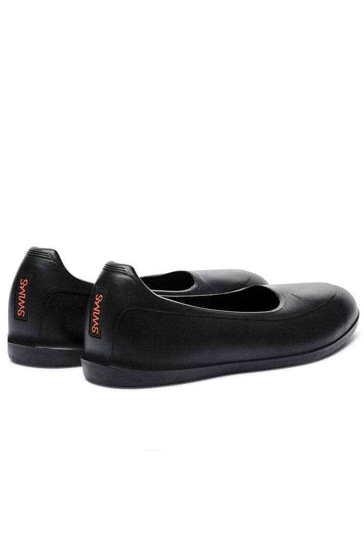 Galoches noires SWIMS, élégantes et imperméables, idéales pour un style raffiné par tous les temps.