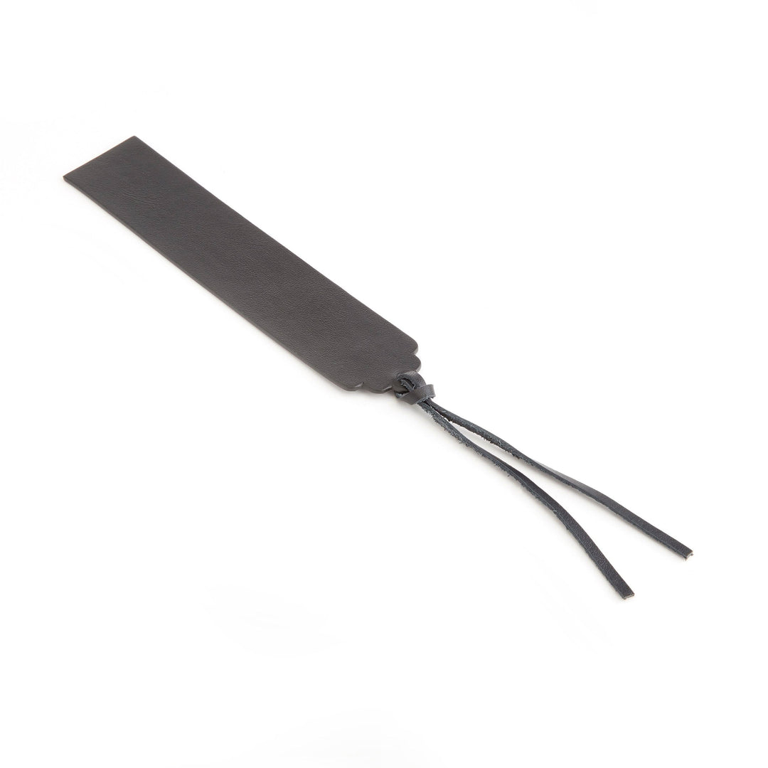 Handmade leather bookmark with tassel for elegant page marking, perfect for personalized gifts.
