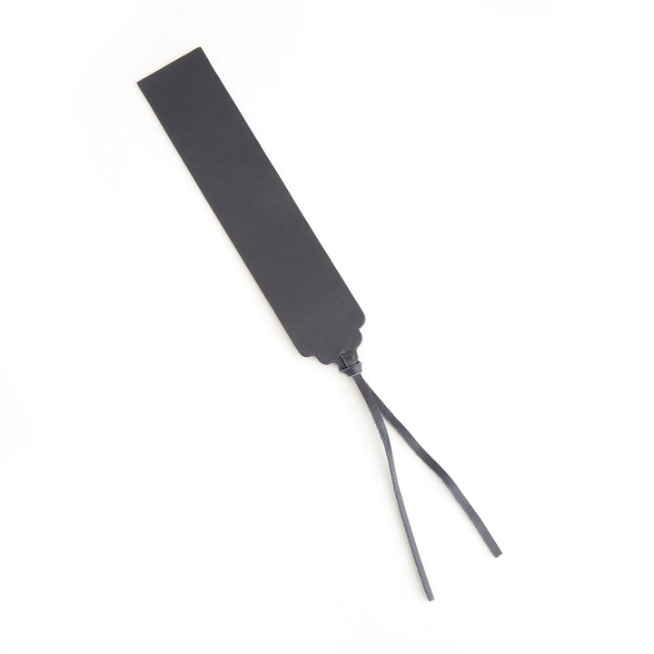 Handmade black leather bookmark with tassel for elegant page marking and free personalization option.