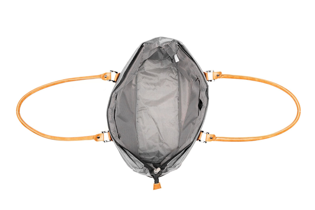 Interior view of PKG Georgian 33L Tote Bag showcasing striped lining and sturdy faux leather handles.