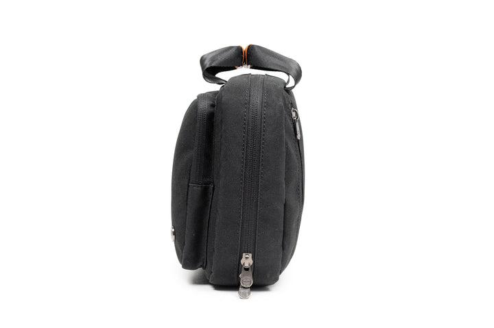 PKG Simcoe recycled accessories bag side view showcasing sleek design and zipper details.