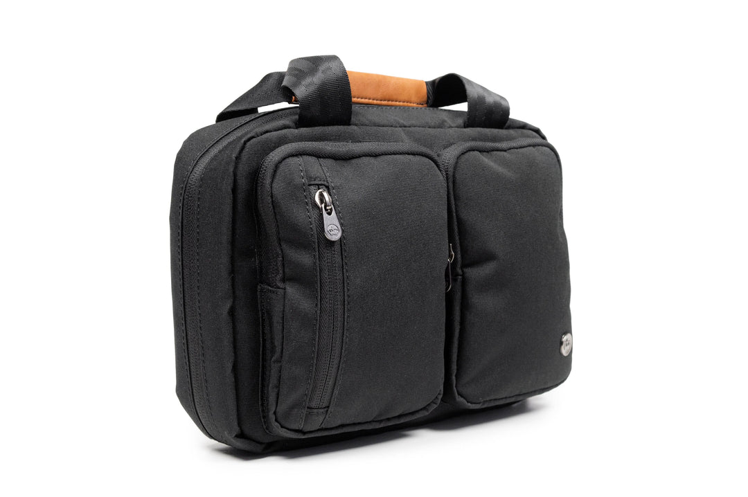 PKG Simcoe recycled essentials bag with two zippered pockets, weather-resistant fabric, and vegan leather accents.