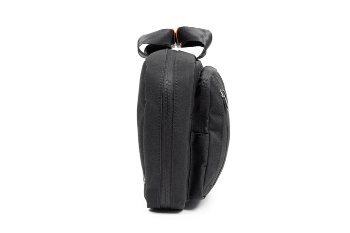 PKG Simcoe recycled essentials bag shown from the side, featuring weather-resistant fabric and sleek design.