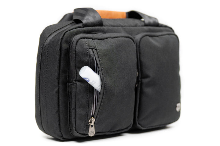 PKG Simcoe recycled essentials bag with multiple pockets and vegan leather accents, perfect for toiletries organization.