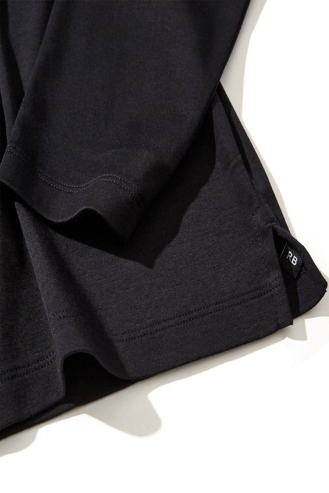 Polo Georgia en coton Pima noir avec col et patte de boutonnage en maille nid d&